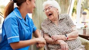 home care services- laughing senior with caregiver